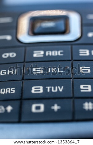 macro shot of an obsolete and blue mobile phone keypad