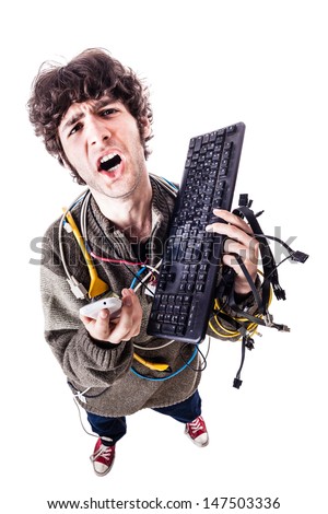 a casual guy with tangled cables and a keyboard struggeling to get computer assistance. isolated on white