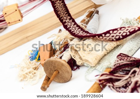some traditional sewing and knitting tools in a medieval fair