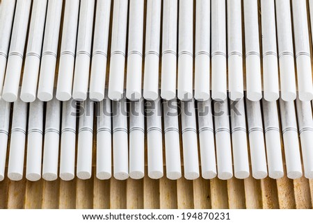 a lot of lined up cigarettes with white filters