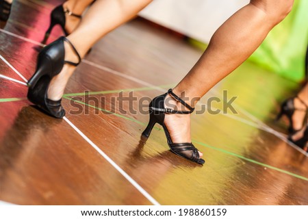 unrecognizable people dancing on the stage of a small theater or a dance floor