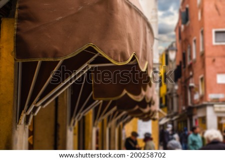 shop tent in a crowded alley in Venice, Italy