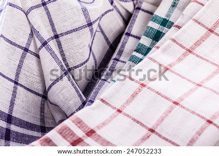 a stack of kitchen dish cloth or canvas in various colors