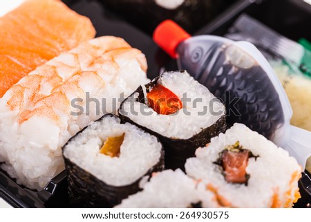 close up shot of a sushi box or bento box with assorted sushi pieces