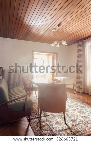 Interior of an austrian house with old retro furniture ready for renovation