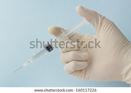 close up of the hypodermic needle and injector
