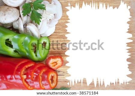 Sliced fresh veggies on bread board with empty space for text