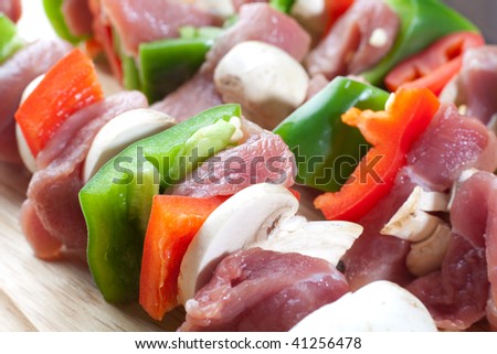 Close up freshly made meat sticks with veggies and pork meat