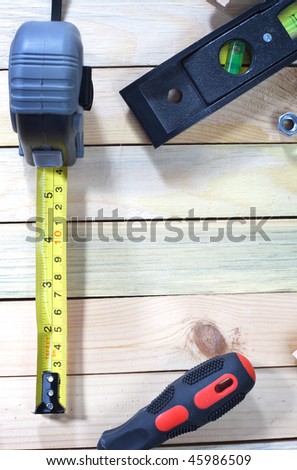 Work tools scattered over wooden planks