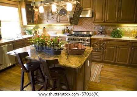 Spacious kitchen with decorated island and modern appliances.