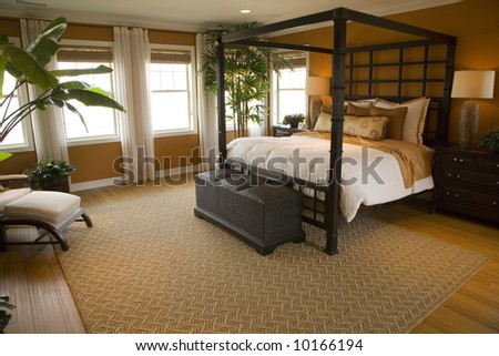 Designer bedroom with contemporary furniture and decor.