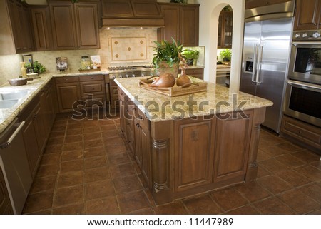 Modern designer kitchen with brown tiles.