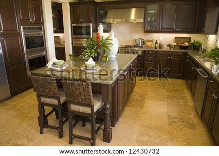 Modern designer kitchen with brown tiles.