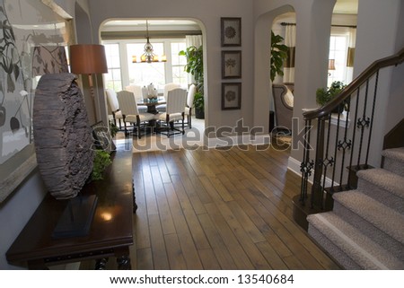 mansion hallway with a hardwood floor and modern decor mansion hallway with a hardwood floor and modern decor
