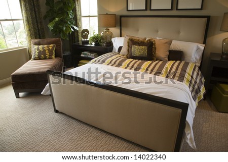 Designer bedroom with contemporary furniture and decor.