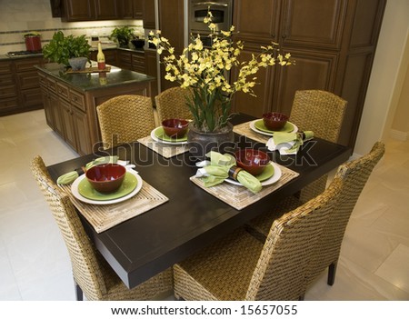 Luxury home dining table with modern tableware.