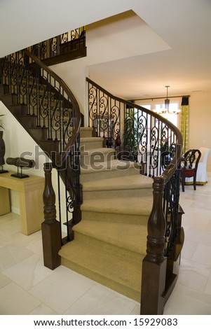 Luxury home staircase with a tile floor.
