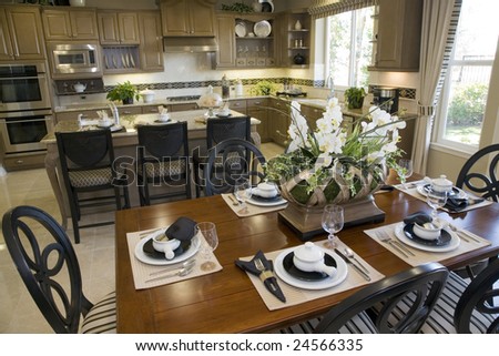 Dining table with luxury home kitchen.