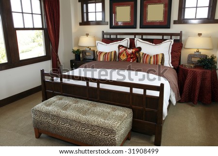 Comfortable bedroom in a luxury home with stylish decor.