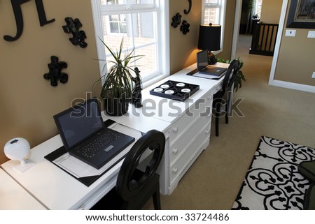 Luxury home desk with two computers.