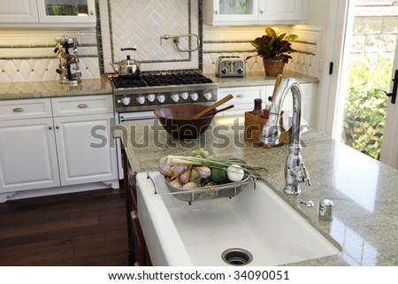 Luxury kitchen with a modern granite island.