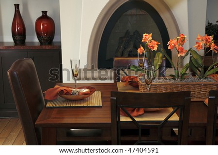 Luxury home dining table with exquisite tableware and decor.