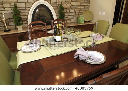 Luxury home dining table with modern tableware.