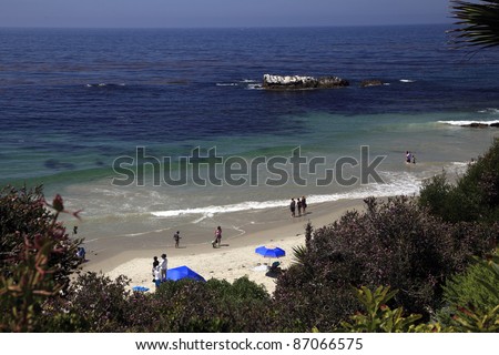 Quiet cove with several people in Laguna Beach California.