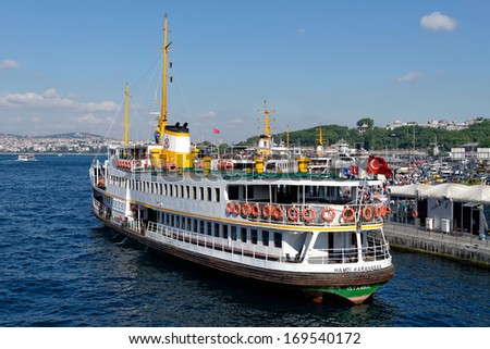 ISTANBUL - JUNE 9, 2013: People get on board the ship at Eminonu on June 9, 2013 in Istanbul. Nearly 150,000 passengers use ferries daily in Istanbul, due to easy access to two different continents.