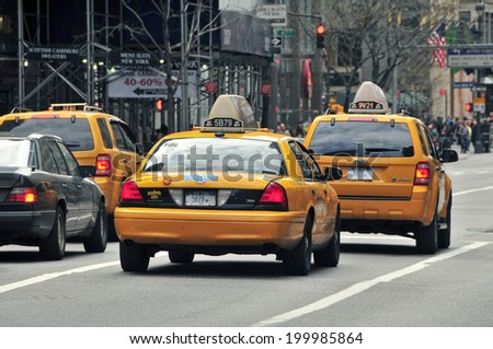 NEW YORK CITY - MARCH 24: Yellow taxis at the street on March 24, 2012 in New York. Yellow cars serve as taxis in NYC and are easy to spot among other vehicles because of their color.