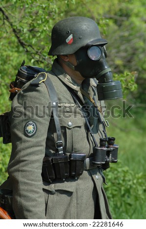 German soldier of World War II in full uniform with gas mask