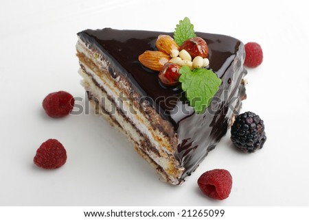 piece of cake with nuts coated with chocolate icing