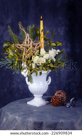 Still life with white roses and christmas decorations