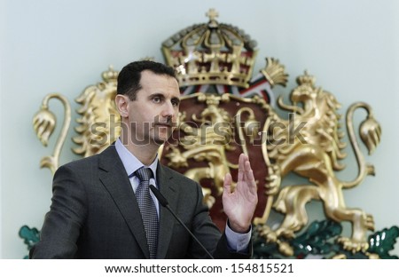 SOFIA, BULGARIA - NOVEMBER 9: Syrian President Bashar al-Assad speaks at a news-conference in Bulgaria\'s Presidents\' office backdropped by Bulgarian national emblem on November 9, 2010.