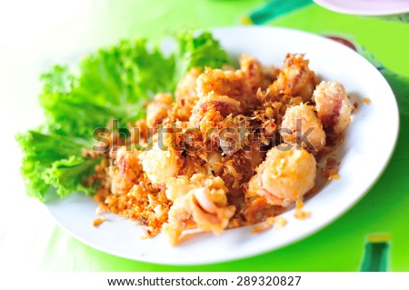 An squid fried in soft light sea food .