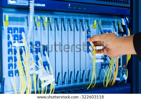 People fix core switch in network room .