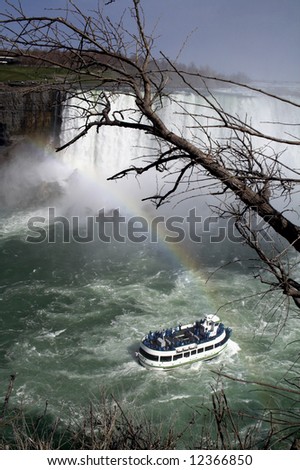 Lovely view of Niagara Falls with boat and rainbow