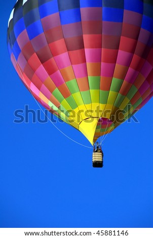 Hot air balloon against brilliant blue sky