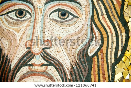 Mosaic: Christ\'s Face. The mosaic is modern, in byzantine style, made by a sicilian artist. It looks like the Blessing Christ in the Cappella Palatina in Palermo or the one in  Monreale Cathedral.