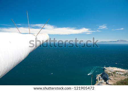 The Strait of Gibraltar.  On the left, the cannon of O\' Hara\'s Battery. On the horizon, the Morocco Coast. In the left corner, the tip of Gibraltar.