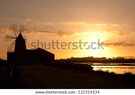 Marsala Saltworks, in Sicily (Italy): Silhouette of a Windmill.