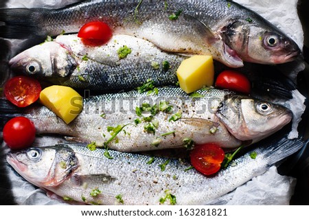 The sea basses, cooked with garlic, potatoes, tomatoes, pepper, parsley, are one of the most delicate italian fish plates. Tomatoes are of the special variety \