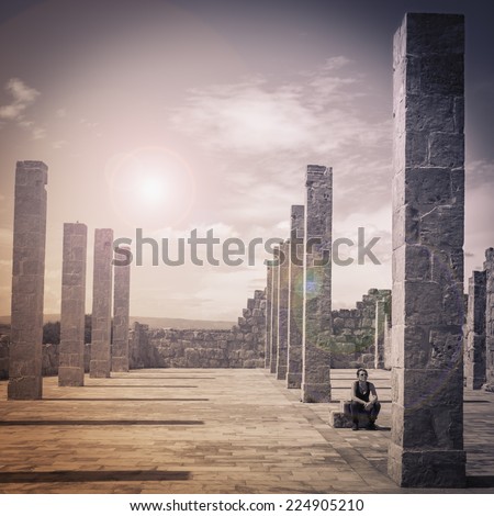 A woman is sitting between the columns in the Tonnara di Vendicari, Siracusa, Sicily. Surreal effect.