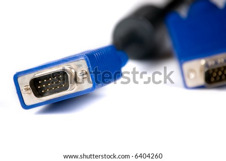 Computer digital video cable on white. Focus on one end of cable with other in background.