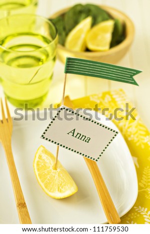 Bright and sunny table setting with a name tag