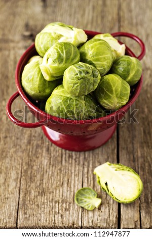 Brussels sprouts in a red colander