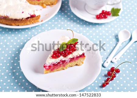 A piece of meringue red currant cake