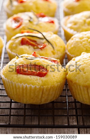 Savory muffins with corn flour, tomatoes and rosemary
