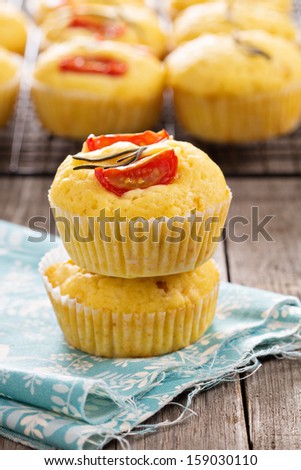 Savory muffins with corn flour, tomatoes and rosemary