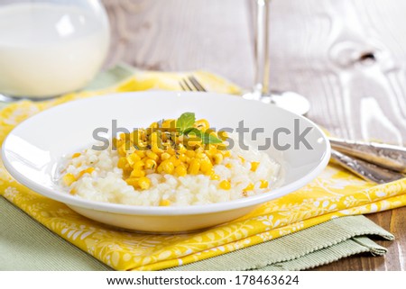 Risotto with baked corn served on a plate